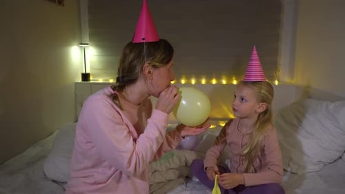 Woman and Child Celebrating Birthday with Balloons
