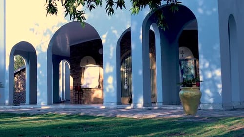 A Still Shot Of The White Orthodox Church Building At Sunset With A Slight Wind