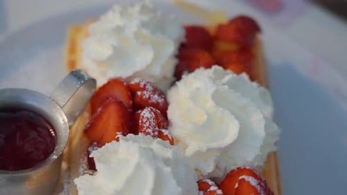 Delicious Waffle with Strawberries and Whipped Cream