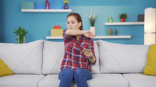 The sick young woman can't stop coughing.