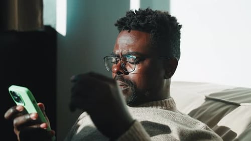 Man Using Smartphone Indoors