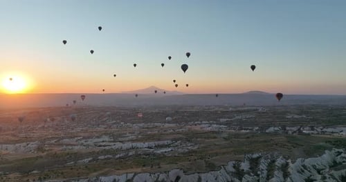Aerial Cinematic Drone View of Colorful Hot Air Balloon Flying Over Cappadocia