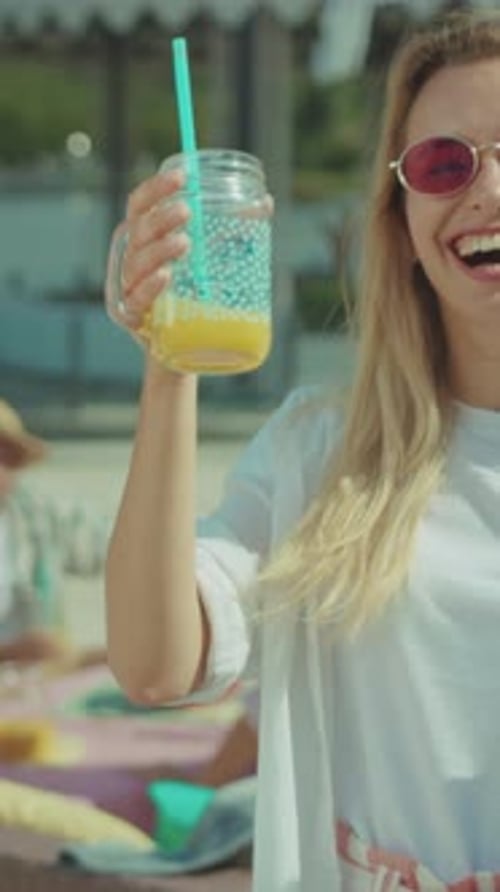 Cheerful Lady with Beverage in Natural Setting Bright Scene of Woman Smiling with Drink in Outdoor