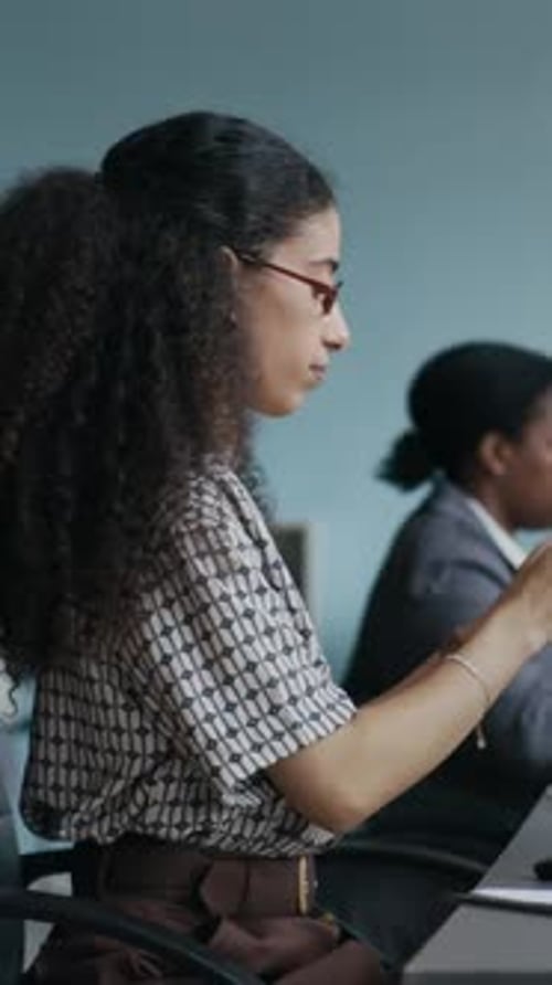 Operator Putting Headset on Head, Taking Notes and Consulting Online Customer