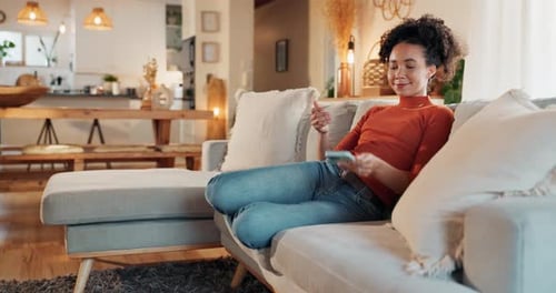 Young Adult Woman Using Phone on Couch