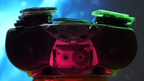 Hand Inserting Cassette Into Retro Boombox
