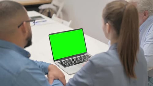Colleagues Working on Laptop with Green Screen