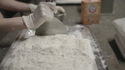 Close up shot of powder being cut up with baking soda