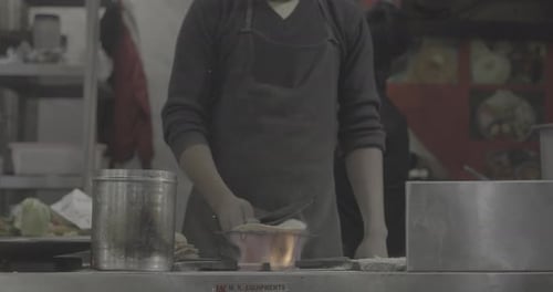 Man Cooking Street Food on