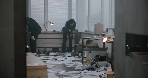 Investigators Collecting Evidence in Chaotic Office