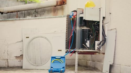 Air Conditioning Unit Being Serviced on Rooftop
