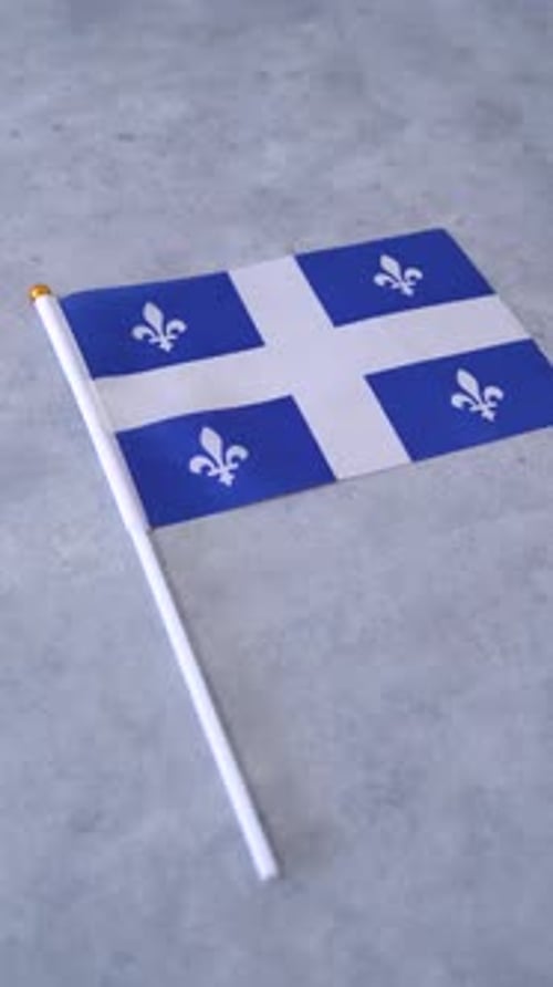 Flag of Quebec, Canadian province. Concept of independence. Vertical shot.