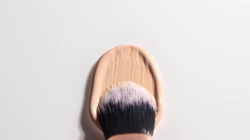 Foundation Makeup Brush Spreading Cosmetics on Surface
