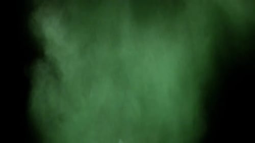 Collider Collection: Green colored powder lingering on a black background