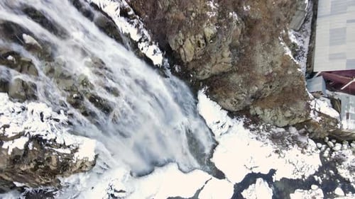 Aerial View of Frozen Waterfall in Winter Landscape