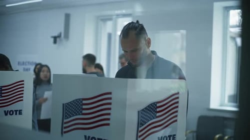 Male Caucasian Citizen Comes to Vote in Booth in Polling Station