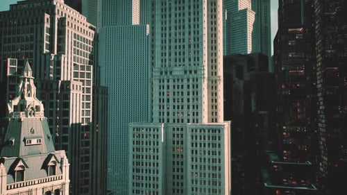 Architectural Contrast in a Bustling City Skyline During Golden Hour