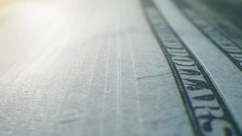 A close-up of one hundred dollar bills. 4K.