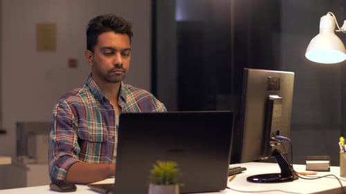 Technology, Deadline and People Concept - Creative Man or Programmer with Computer