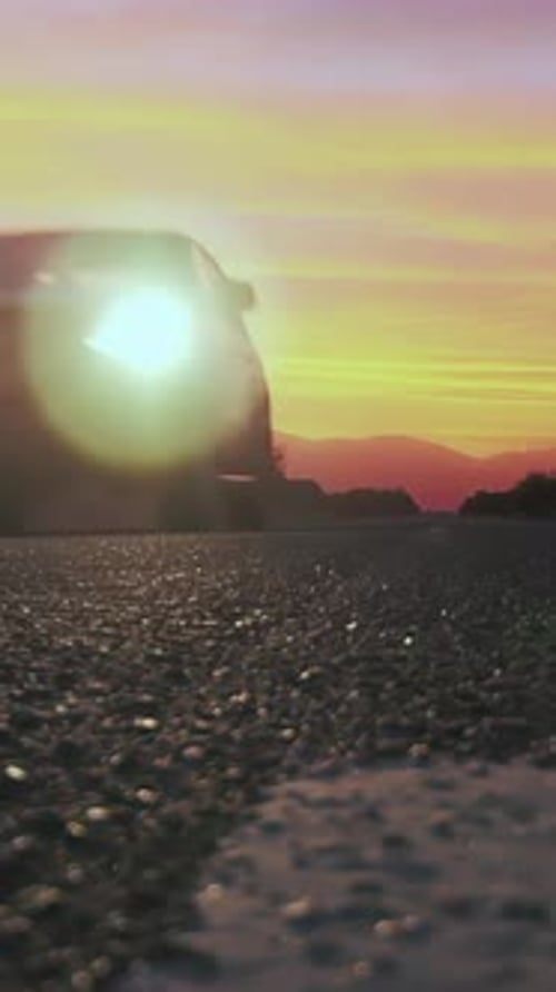 Pickup Truck on Road at Sunset, Low Perspective.