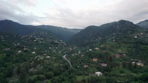 Aerial View on Village in Mountains Near to Sea