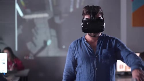 Concept Futuristic Design Yound Man Architect or Engineer Wearing VR Headset for Working Design 3D