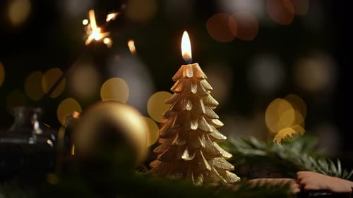 Golden Christmas Decorations with Candle and Sparkler