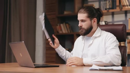 Businessman Talking By Video Call in Office