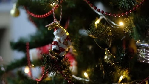 Happy New Year Christmas Tree Decorates with Red Glass Ball on Branch on Background Bokeh of Side