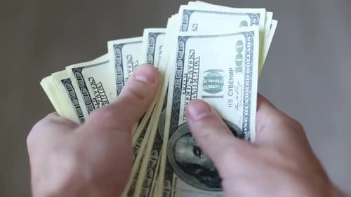 counting money, dollar money. counting cash