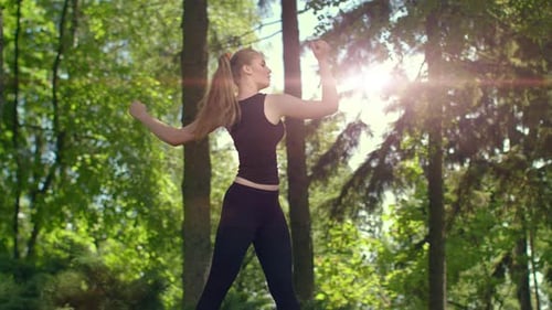 Woman Stretching in Park at Evening. Young Female Runner Warm Up Outdoor