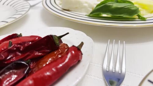 Plate of Red Peppers at Breakfast Table