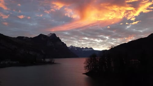 Switzerland Alps lake and mountains at sunset