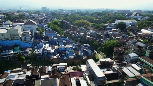 Aerial Panorama Showcasing the Vibrant Arema Blue Village in Malang and Its Scenic Surroundings