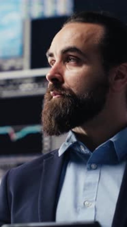 Vertical Video Business Expert Reflecting on Monthly Performance Metrics on Dashboards
