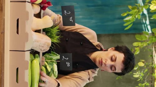 Female Vendor Smiles at Fresh Produce Stand