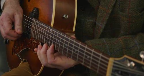 Jazz guitar, Archtop, f soundhole being played