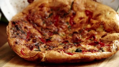 Freshly Baked Savory Vegetable Quiche on a Wooden Board