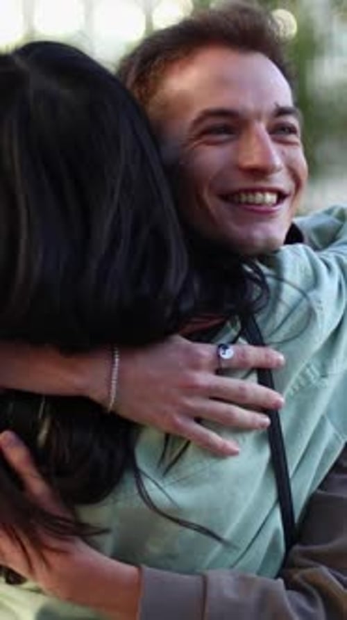 Affectionate Young Couple Hugging and Smiling in the City