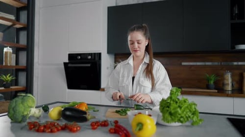 Woman Prepares Healthy Vegetables in Modern Kitchen