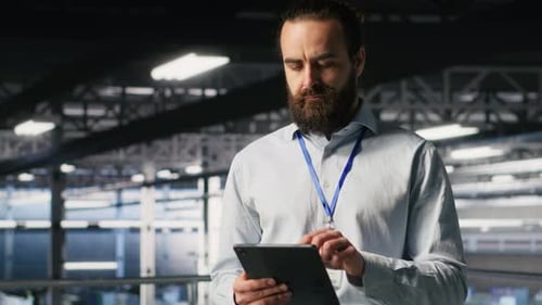 Server Room Technician Next to Coworkers Reviewing AI LLM Visualization