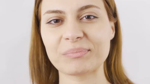 Woman eating pistachio in close-up. Nuts.
