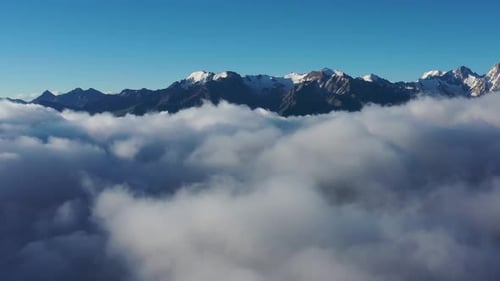 Aerial View of Clouds and Mountains at Sunrise