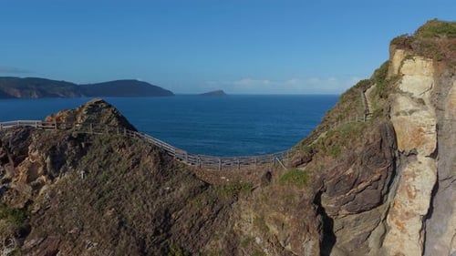 Aerial view of coastline with wooden walking path