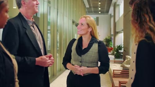 Professionals Talking During a Meeting at a Modern Office