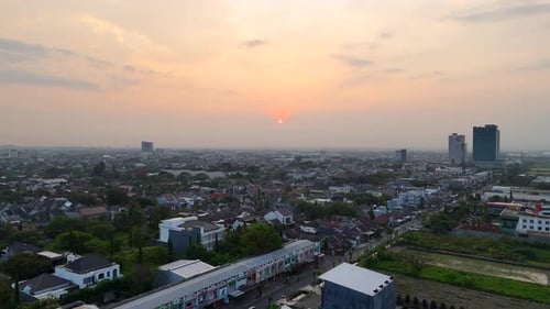 Golden sunrise over Solo Baru skyline, Central Java, Indonesia.