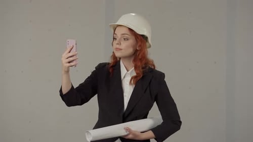 Construction Worker Using Cell Phone for Video Call