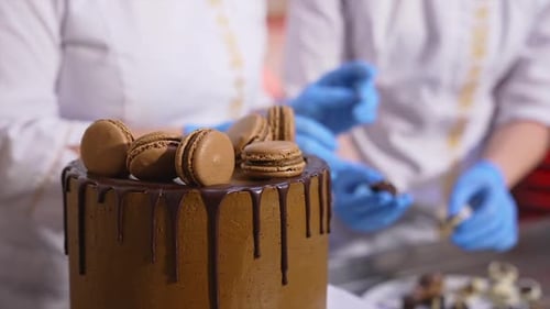 Decorating Chocolate Cake with Macaroons and Chocolate