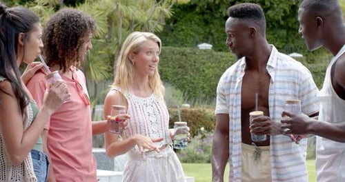 Friends Laugh and Converse at Backyard Gathering