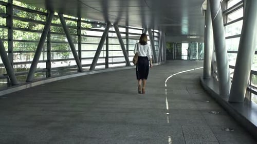 Businesswoman Walking Through Tunnel In City, Super Slow Motion 120fps